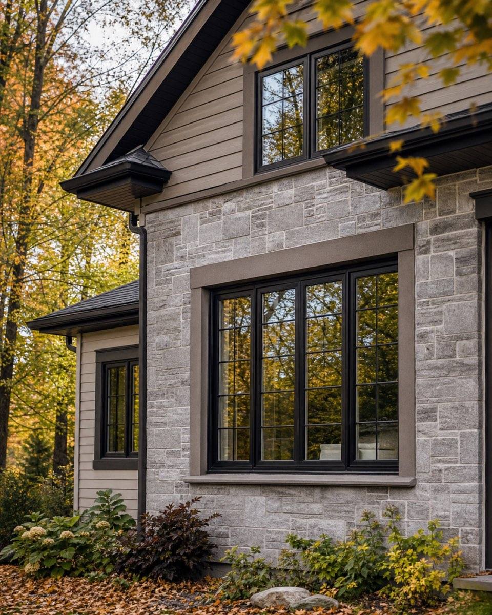 Stone home with new black-frame windows